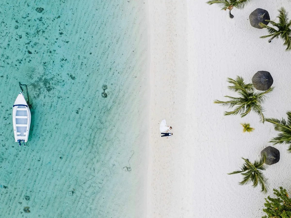 White sand and turquoise water at Île aux Cerfs