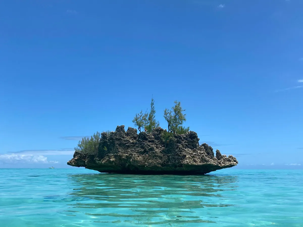 Crystal Rock rising from the turquoise lagoon